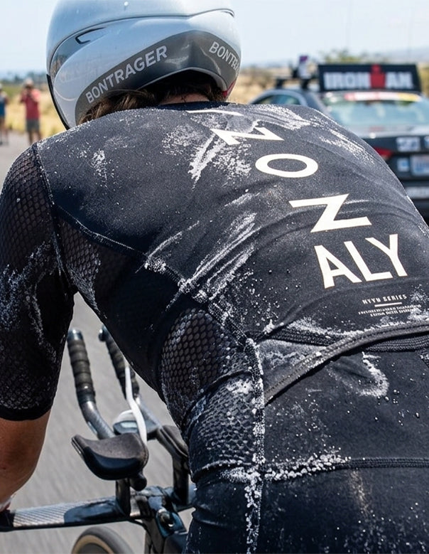 Dark running shirt with visible white salt marks after a long workout, showing electrolyte loss through sweat